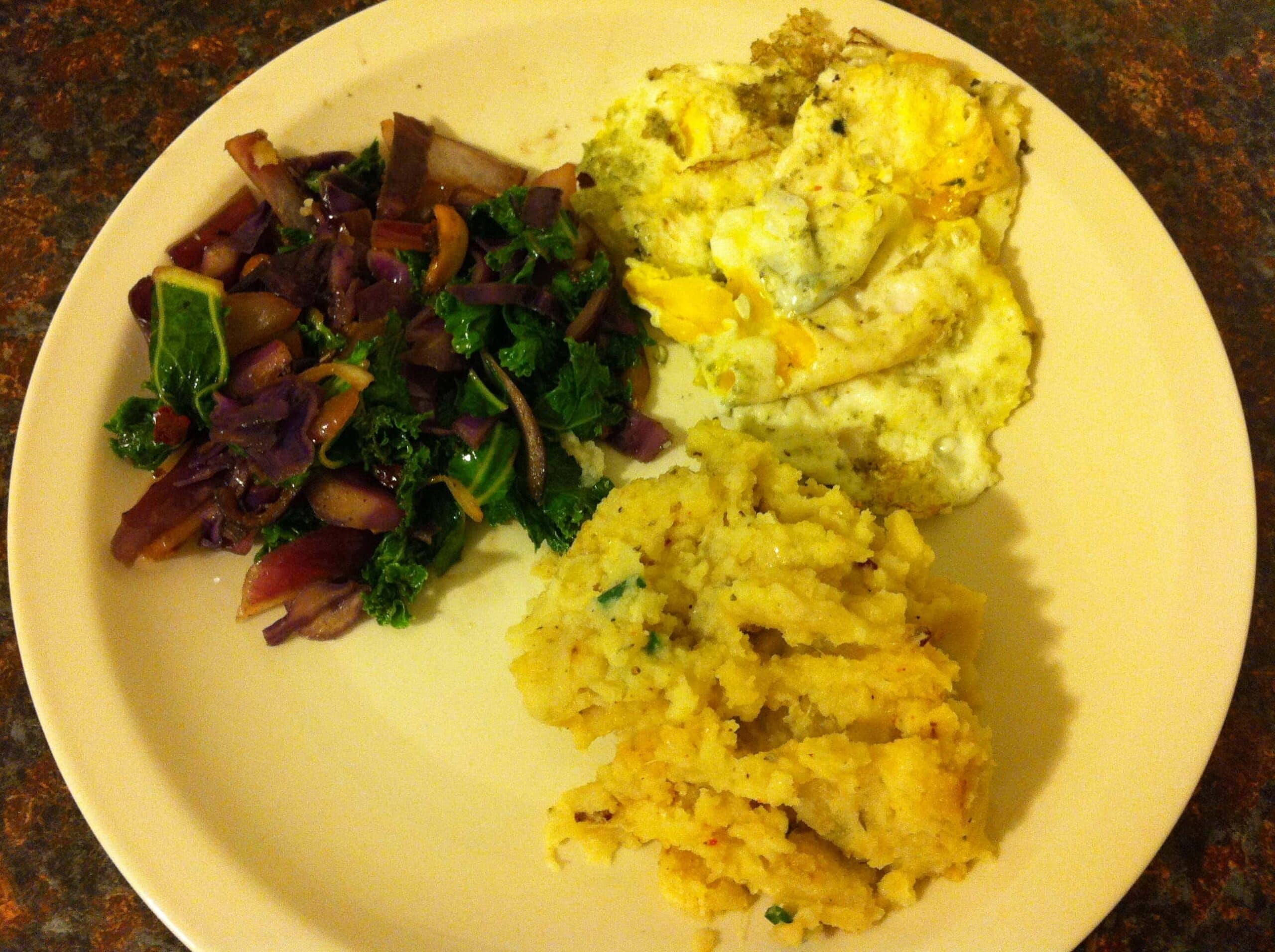 plate of healthy food with eggs roasted garlic mashed cauliflower 