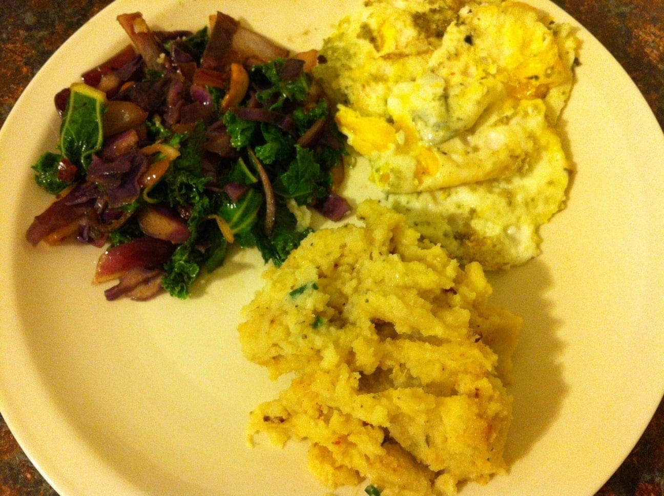 plate of healthy food with eggs roasted garlic mashed cauliflower 