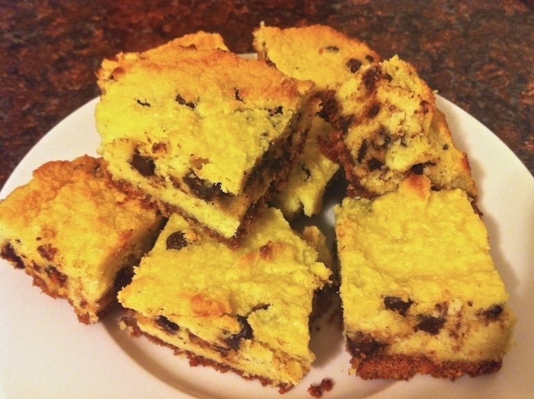 plate of numerous pieces of coconut chocolate chip cake on a white plate