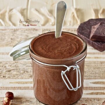 jar of homemade Nutella chocolate hazelnut spread with spoon inside jar