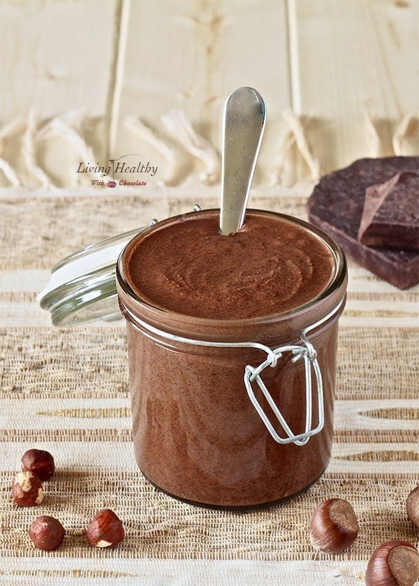 jar of homemade Nutella chocolate hazelnut spread with spoon inside jar