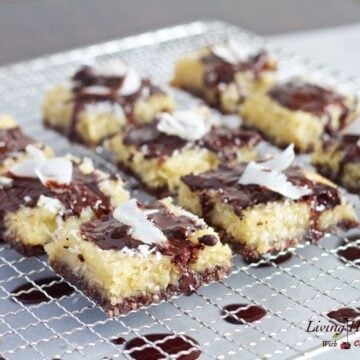 paleo coconut brownie bars drizzled with chocolate cooling on a wire rack