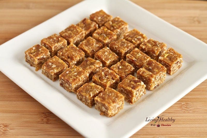 square plate with paleo apricot coconut lemon bites cut into bite size squares