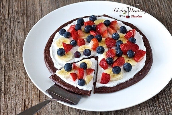 large serving plate with chocolate brownie fruit pizza