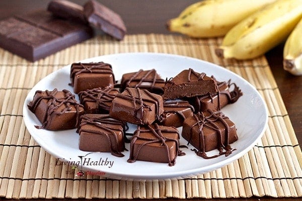 plate with numerous squares of frozen peanut butter Chocolate banana fudge bites drizzled in chocolate 