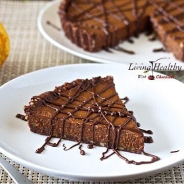 slice of paleo triple chocolate pumpkin pie drizzled with chocolate and remaining pie in background