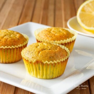 three lemon chia seed muffins on a white plate