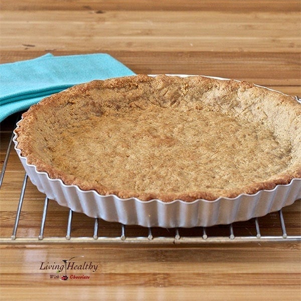 pie crust cooling on a wire rack with blue napkin in background