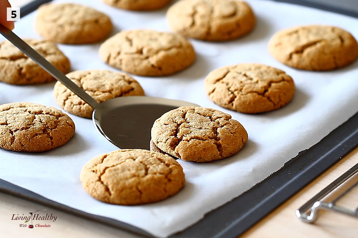 a few gluten-free cookies on a baking sheet with parchment paper