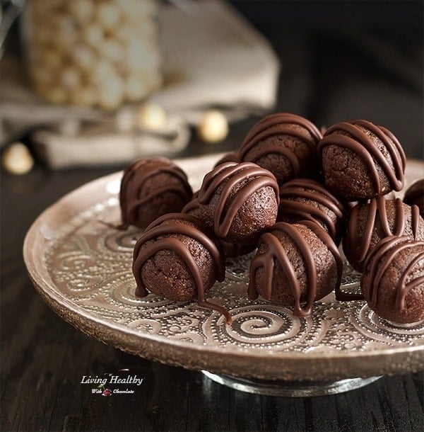 hazelnut fudge balls stacked on a plate 