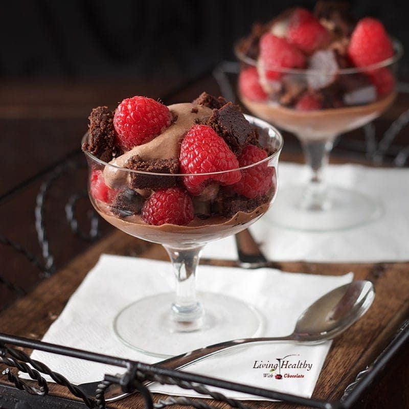 A dessert on a plate on a table, with Chocolate and Cream