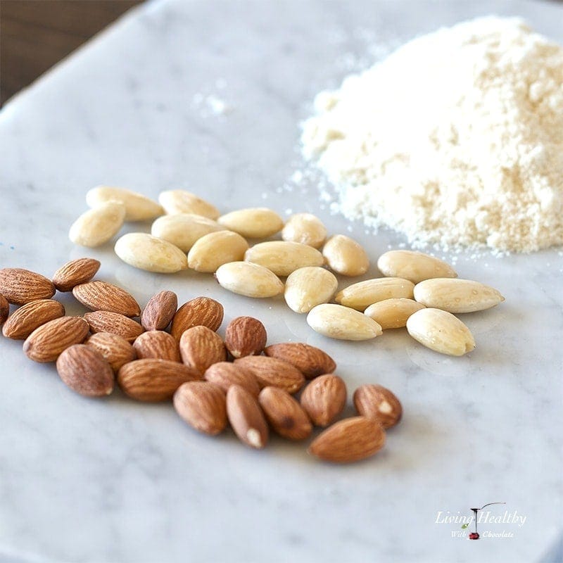 two piles of almonds and one pile of almond flour to show the stages of how to blanch and how to make almond flour