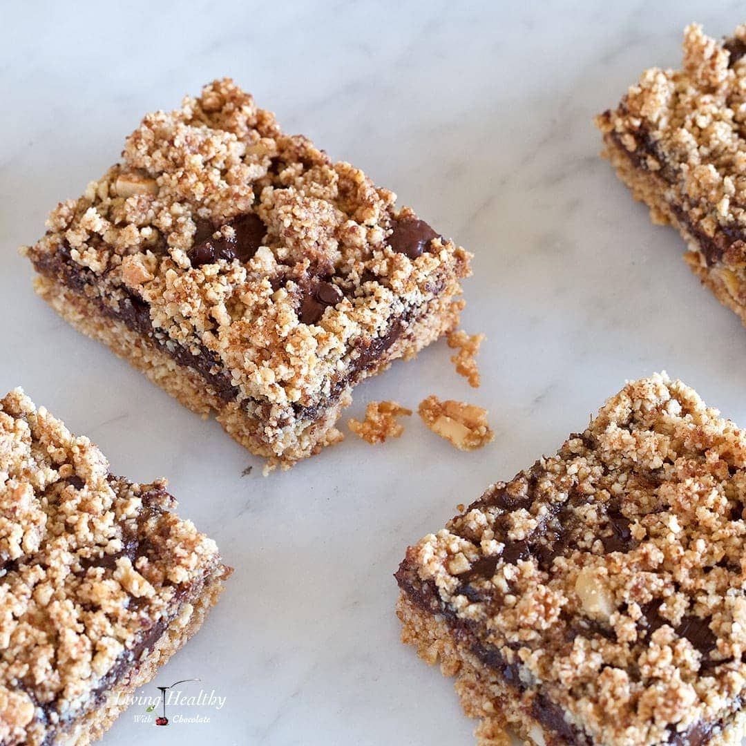 close up of chocolate caramel bars on marble countertop 