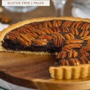 Chocolate Pecan Pie in a serving plate with a slice taken off